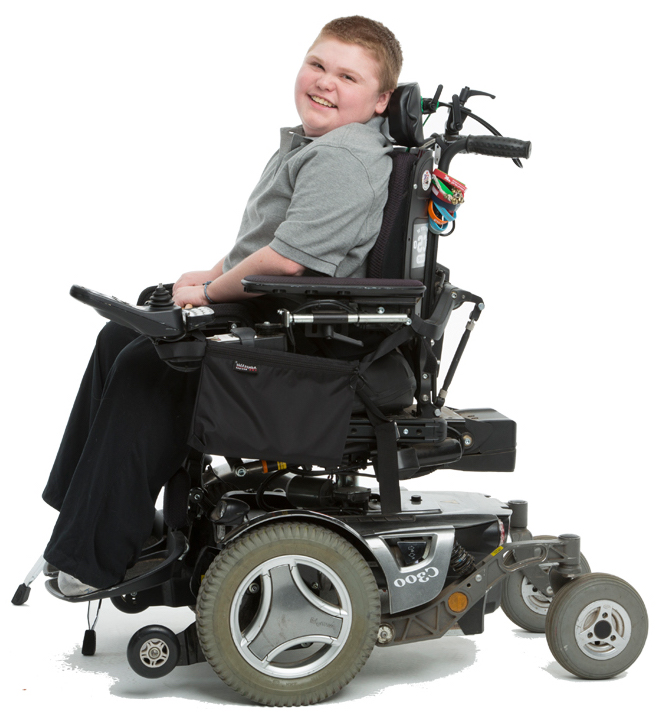 Boy in motorized wheelchair